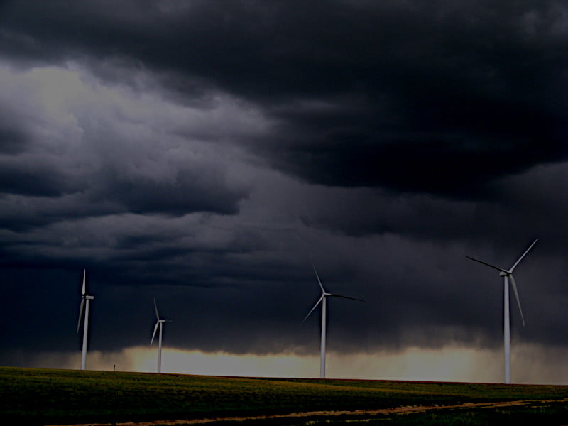 Wind turbines during an approaching thunderstorm.